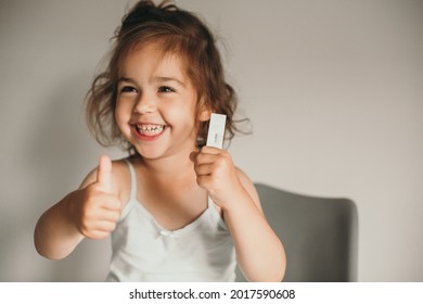 Smiling Child Got Negative Covid Test. Horizontal Photo