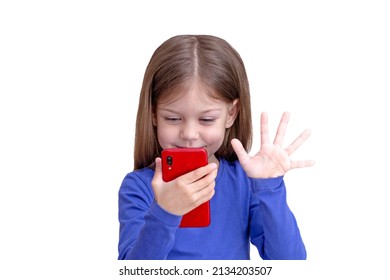 Smiling Child Looking At Mobile Phone And Waving To Screen, Isolated On White Background Waist Up Caucasian Little Girl Of 5 Years In Blue