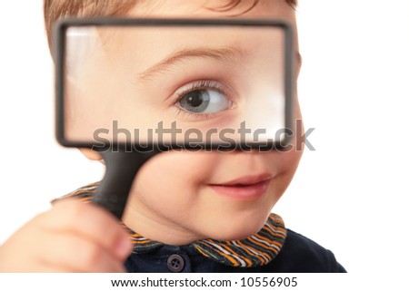 Similar – Child with reading magnifier