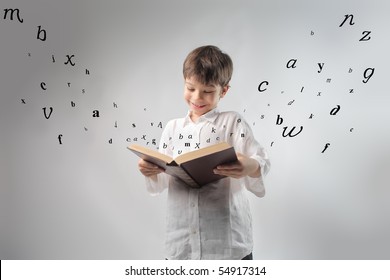 Smiling Child Reading A Book With Letters Flying Away From It