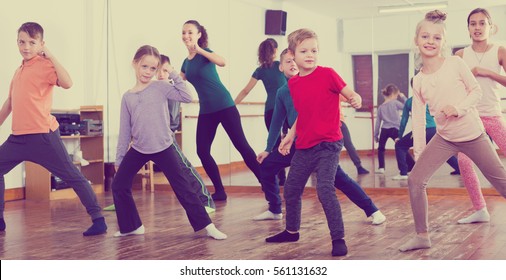 Smiling Children Studying Modern Style Dance In Class