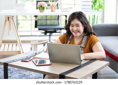 Smiling Chubby Woman Works From Home And Studying With Computer Laptop