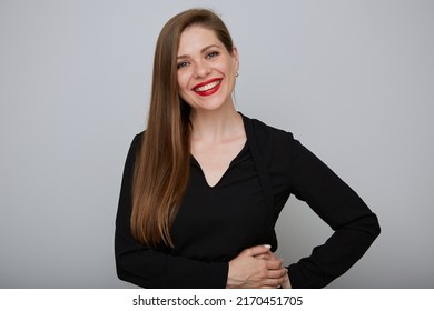 Smiling Confident Business Woman Or Office Worker In Black Shirt Holding Hands On Hip And Touching Her Chin, Isolated Female Portrait.