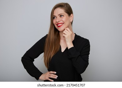 Smiling Confident Business Woman Or Office Worker In Black Suit Holding Hands On Hip And Looking Away, Isolated Female Portrait.