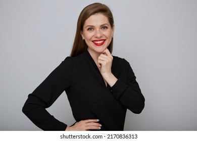 Smiling Confident Business Woman Or Office Worker In Black Shirt Holding Hands On Hip And Touching Her Chin, Isolated Female Portrait.