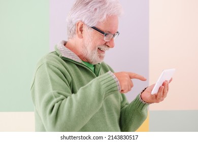 Smiling Confident Male Video Chat With Digital Tablet Held In His Hands Standing On Cute Background. White-haired Mature Caucasian Man With Glasses, College Student Of The Third Age University