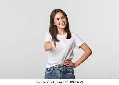 Smiling Confident Young Woman Extend Hand For Handshake, Greeting Person