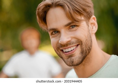 Smiling Contented Gorgeous Guy Posing For The Camera