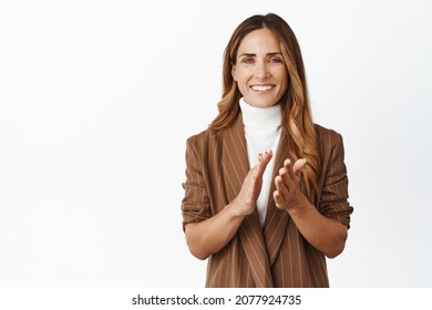 Smiling Corporate Woman Clap Hands, Praising You, Looking Pleased And Give Applause To Colleague, White Background