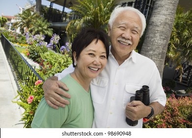 Smiling Couple with Binoculars
