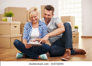 Smiling Couple Buying New Furniture For Their Home  