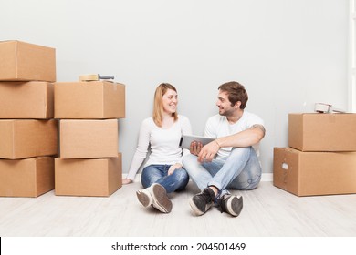 Smiling Couple Buying New Furniture For Their Home