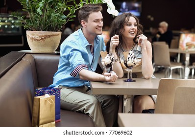 Smiling Couple Eating Ice Cream