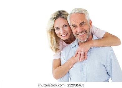 Smiling Couple Embracing And Looking At Camera On White Background