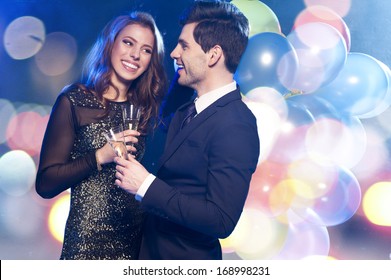 Smiling Couple With Glasses Of Champagne 