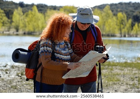 Similar – Image, Stock Photo Redheaded hiker with water bottle on nature getaway
