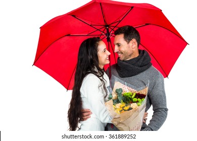 Smiling couple holding umbrella and bouquet on white background - Powered by Shutterstock