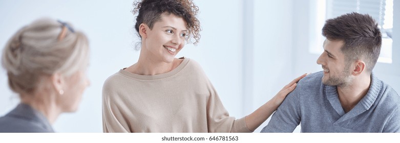 Smiling Couple Looking At Each Other During Marital Therapy Session 