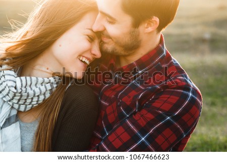 Smiling couple in love outdoors.