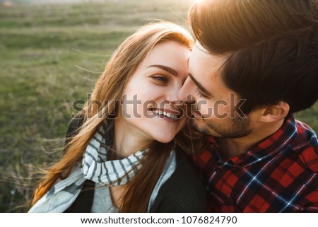 Smiling couple in love outdoors.