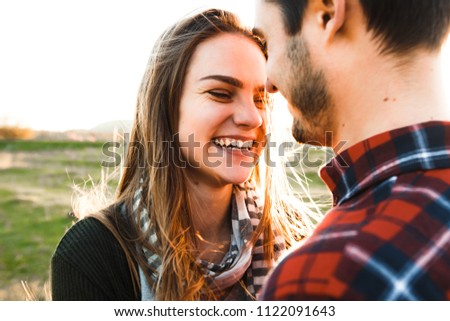 Smiling couple in love outdoors.