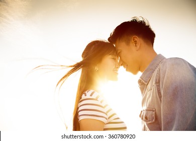 Smiling Couple in love with sunlight background
