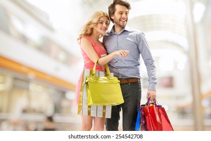 Smiling Couple In A Shopping Mall