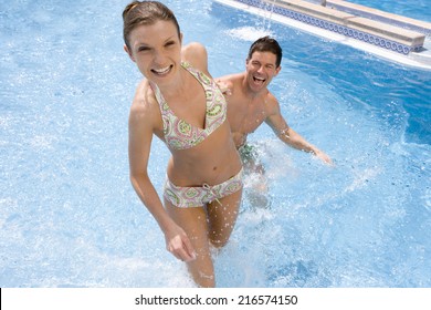 Smiling Couple In Swimming Pool