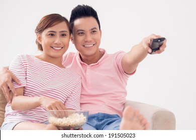 Smiling Couple Watching Tv