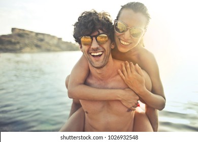 Smiling Couple Wearing Sunglasses