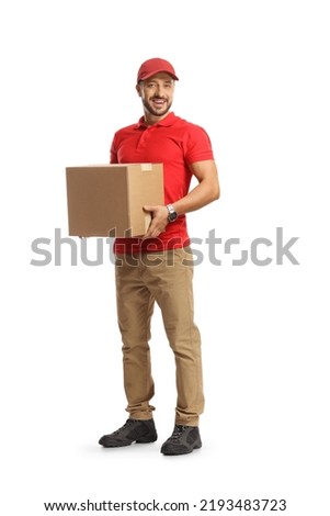 Smiling courier holding a cardboard box isolated on white background