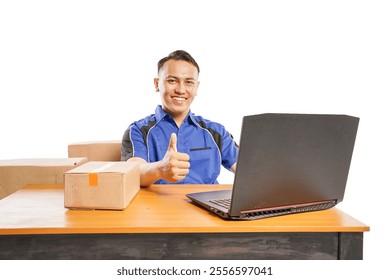 smiling courier while looking at camera give thumbs up while using laptop in office isolated on white background