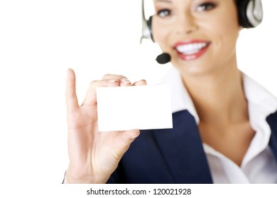 Smiling Customer Service Representative With Headset Holding A Blank Empty Card. Isolated On White Background.