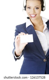 Smiling Customer Service Representative With Headset Holding A Blank Empty Businesscard. Isolated On White Background.