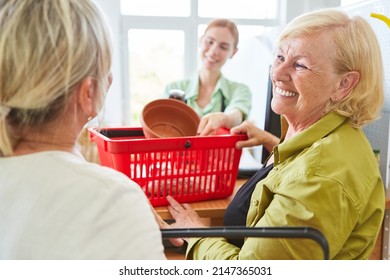 Smiling Customer When Paying At The Checkout Of The Garden Center Or Hardware Store