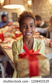 Smiling Cute African Girl Celebration Holiday And Giving Christmas Present
