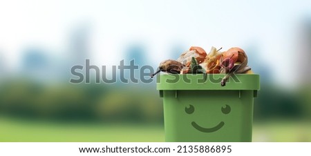 Smiling cute garbage bin character full of organic biodegradable waste, separate waste collection and recycling concept