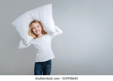 Smiling Cute Girl Holding Pillow