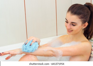 Smiling Cute Girl Washes The Body Foam Bath Washcloth