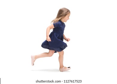 Smiling Cute Toddler Girl Three Years Running Over White Studio Background. Caucasian Model With Long Flowing Hair In Summer Dress.