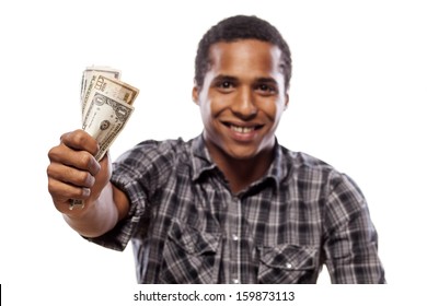 Smiling Dark-skinned Young Man Shows A Wad Of Cash In Hand