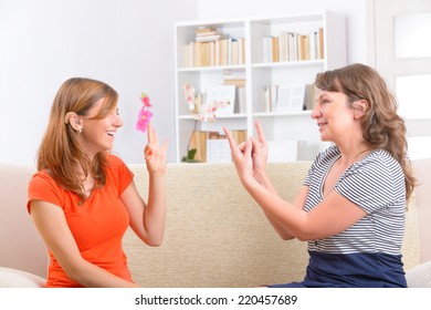 Smiling Deaf Woman Learning Sign Language And Talking With Her Teacher