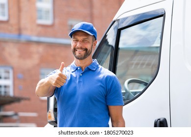 Smiling Delivery Men Or Handyman In Uniform Near Truck
