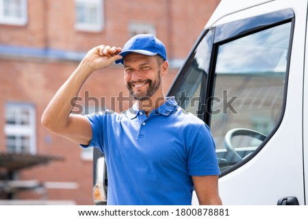 Smiling Delivery Men Or Handyman In Uniform Near Truck