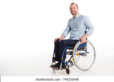 smiling disabled man in wheelchair looking at camera, isolated on white - Powered by Shutterstock