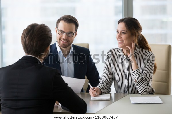 Smiling diverse HR managers satisfied about male\
job employee, have positive first impression of candidate, happy\
employers listen to applicant at interview excited of candidature.\
Recruitment concept
