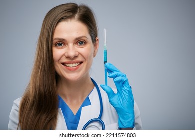 Smiling Doctor Holding Syringe With Vaccine. Isolated Female Medical Worker Portrait.