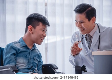 Smiling doctor interacting with a happy young patient in wheelchair during a medical consultation in a well-lit office. - Powered by Shutterstock