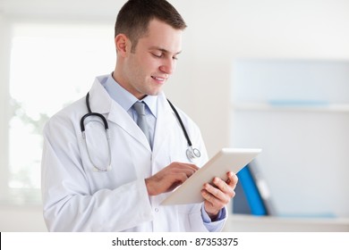 Smiling Doctor Using Tablet