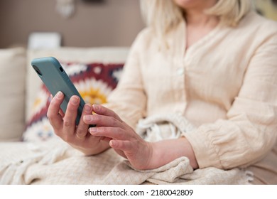 Smiling Elderly Lady Talking On Cell Phone Modern Technology At Home For Weekend Lifestyle, Happy Elderly Woman Shopping Online On Phone Select Sale Offers.